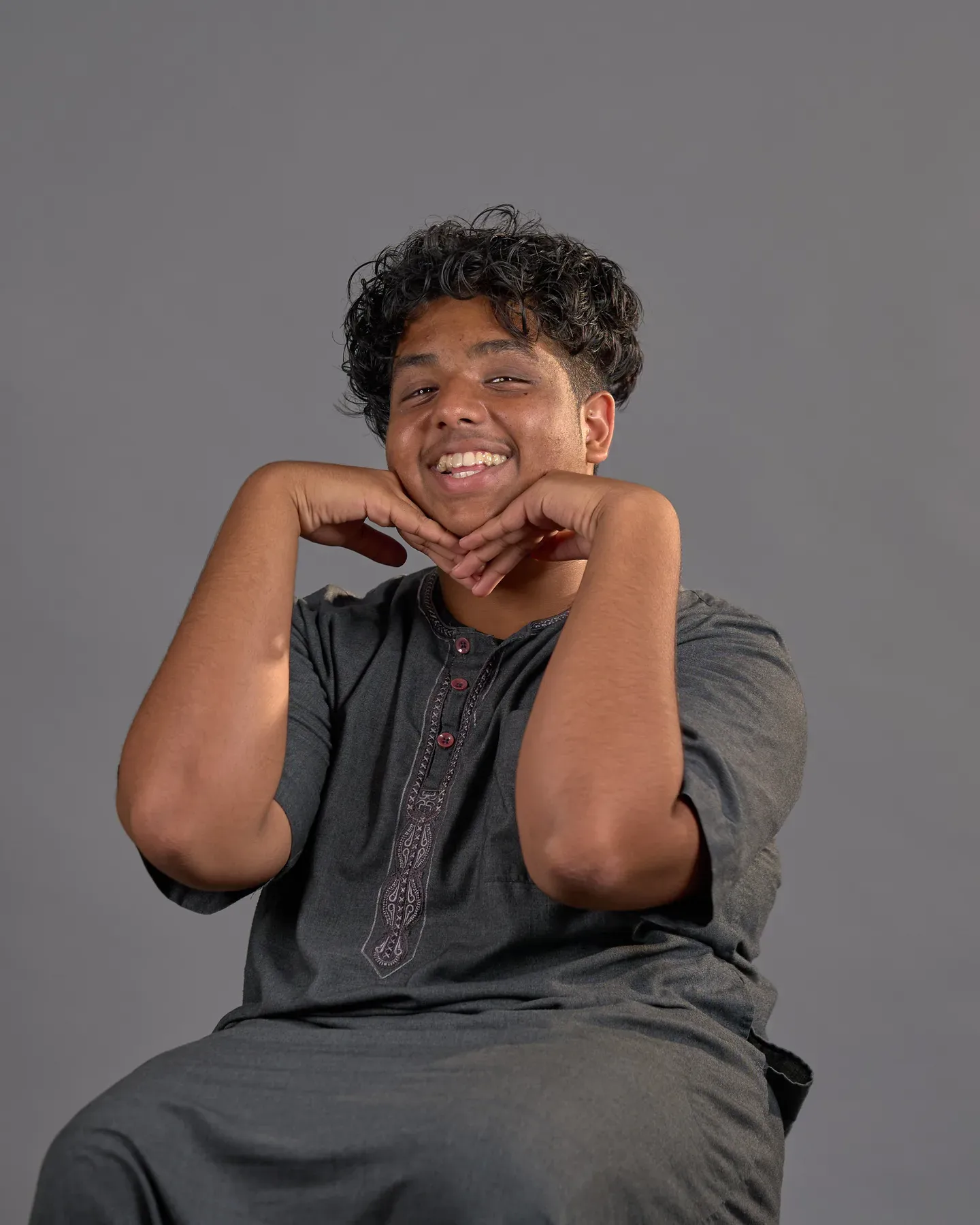 Bayaan Academy student smiling for a yearbook portrait